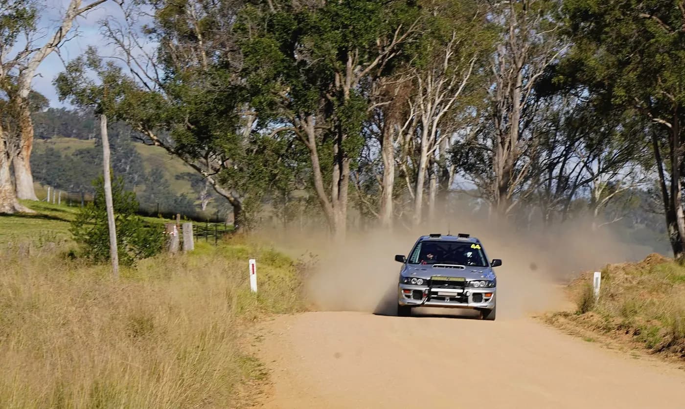 Shakewell Racing Subaru Impreza disappearing into a dust cloud on a gravel road, 2026