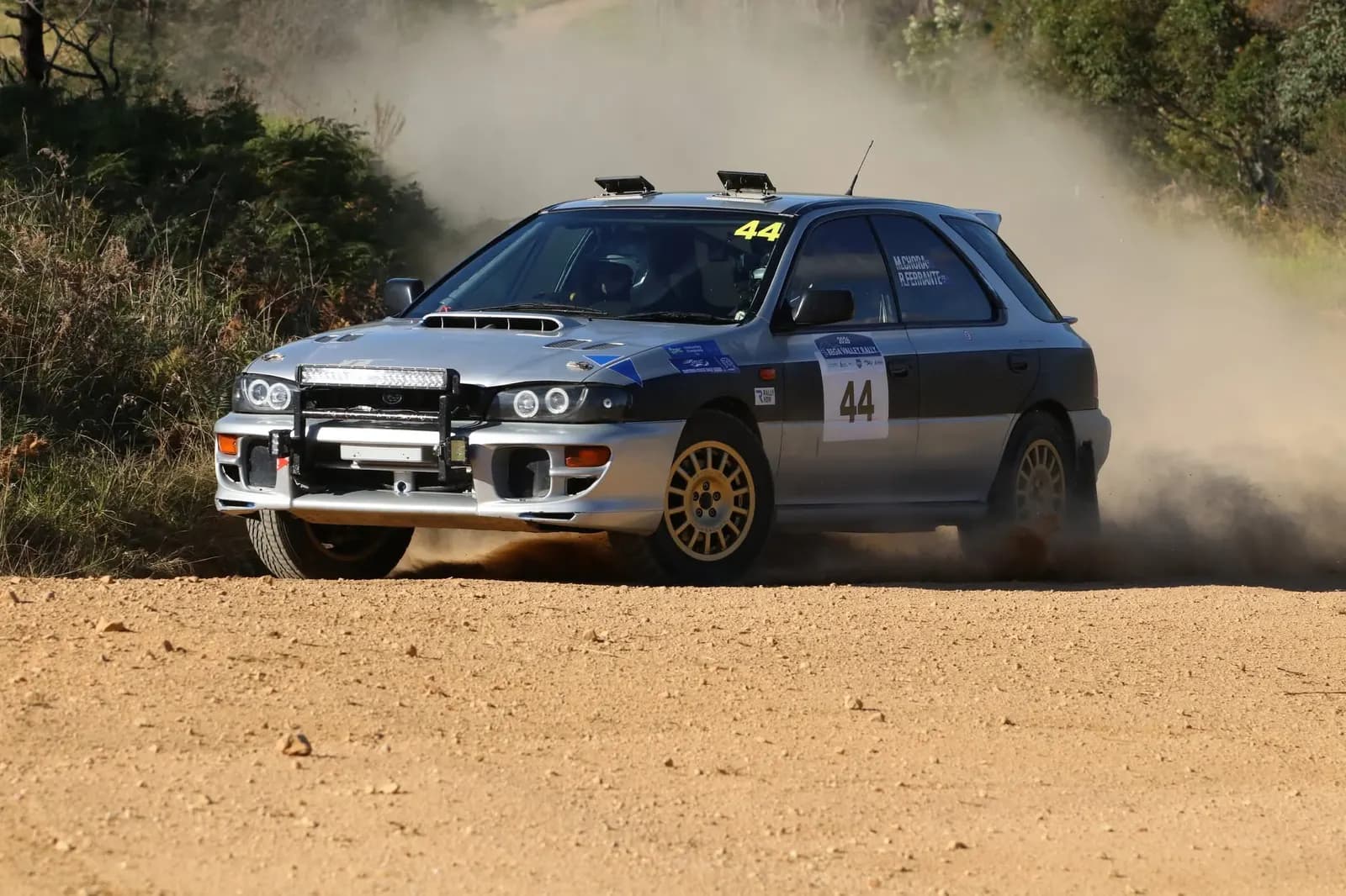 Shakewell Racing's Subaru Impreza spraying gravel and dust on a 2026 rally stage