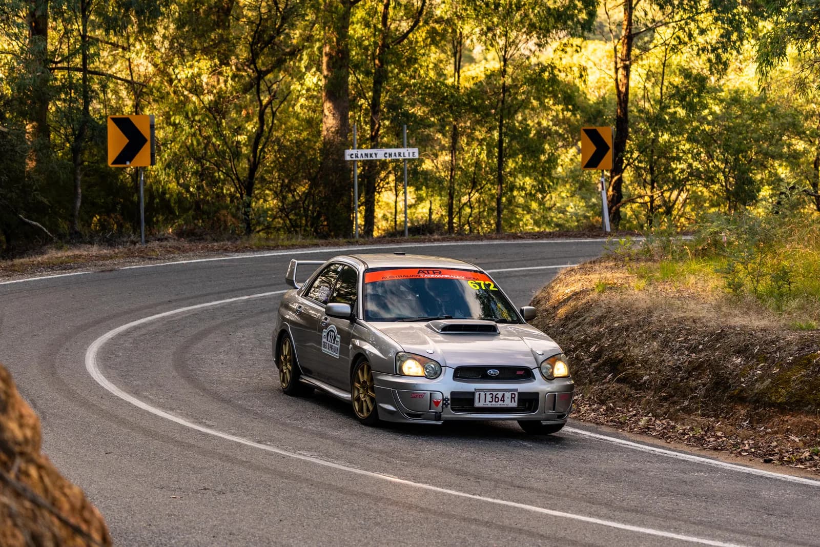 Shakewell Racing's silver Subaru WRX STI cornering on an autumn tarmac mountain road at the 2026 Great Alpine Rally