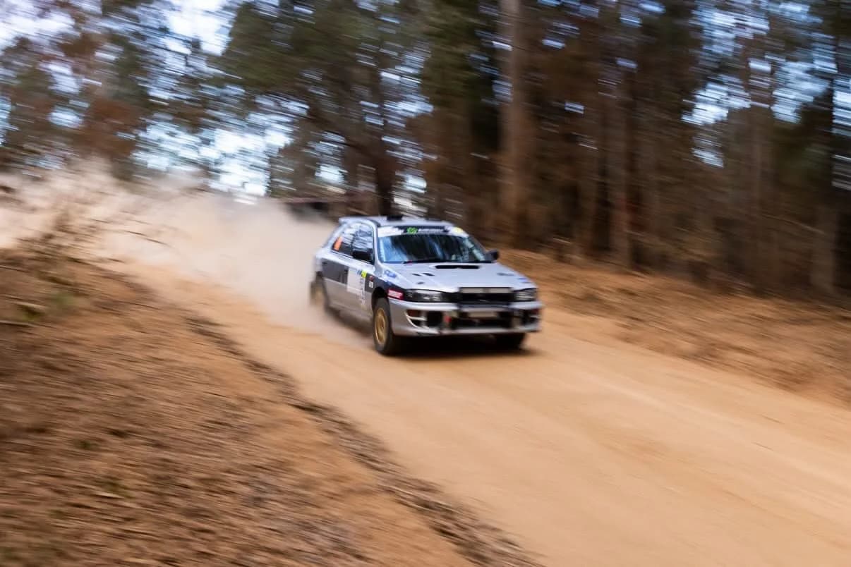 Shakewell Racing Subaru Impreza kicking up dust on a forest gravel stage at the 2026 Narooma Forest Rally
