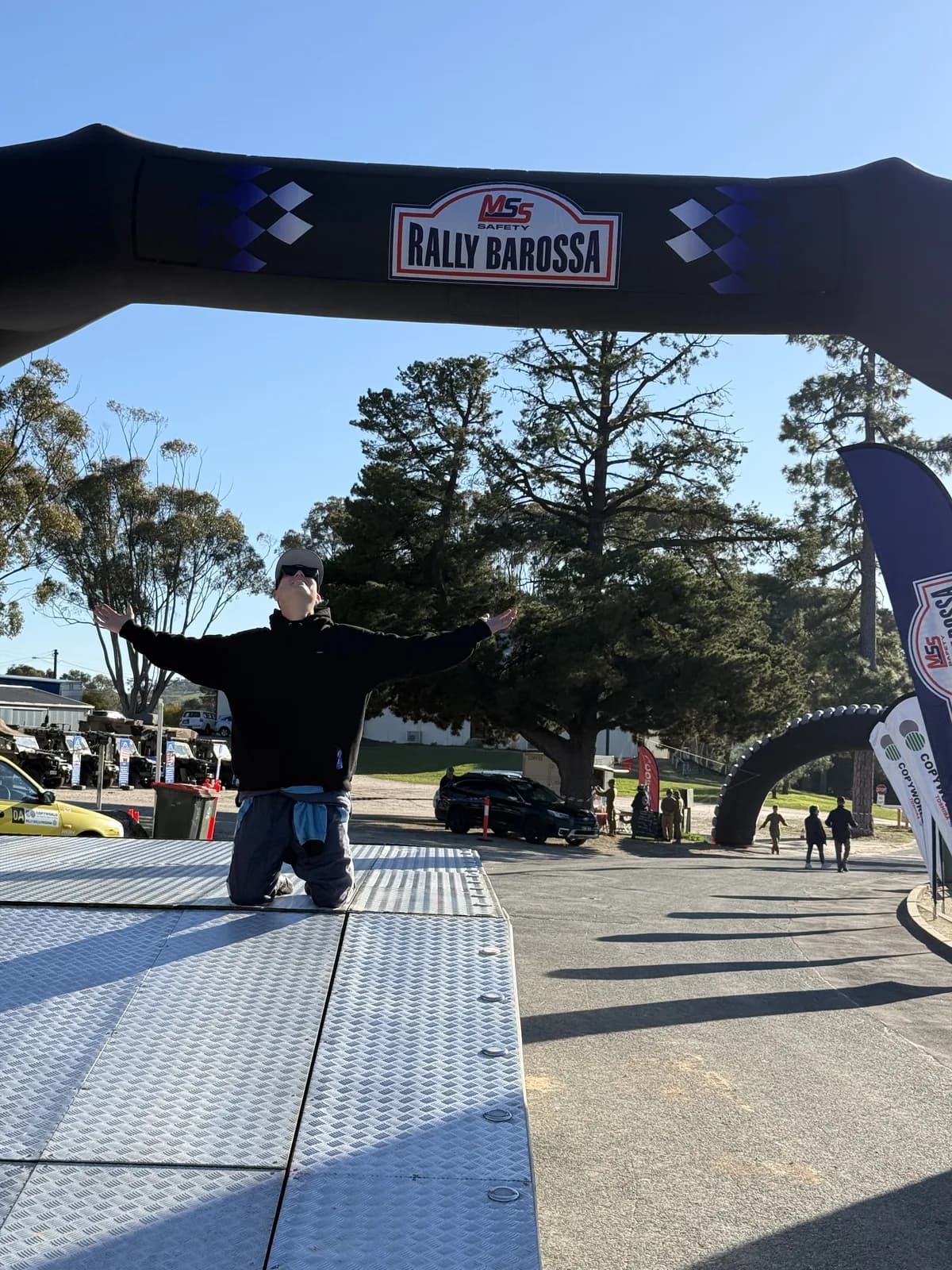 Soaking up the moment on the podium ramp under the MSS Safety Rally Barossa start arch