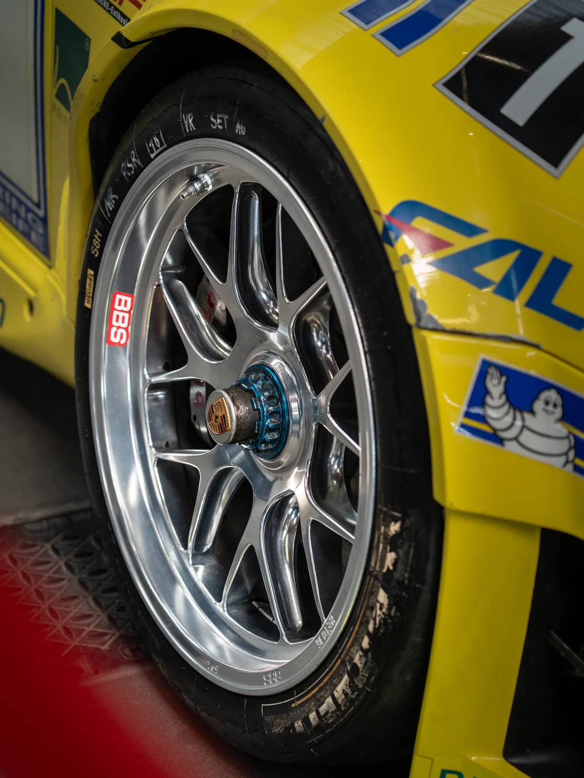 Close-up of a centre-lock wheel on a Falken-liveried race car at the Nürburgring