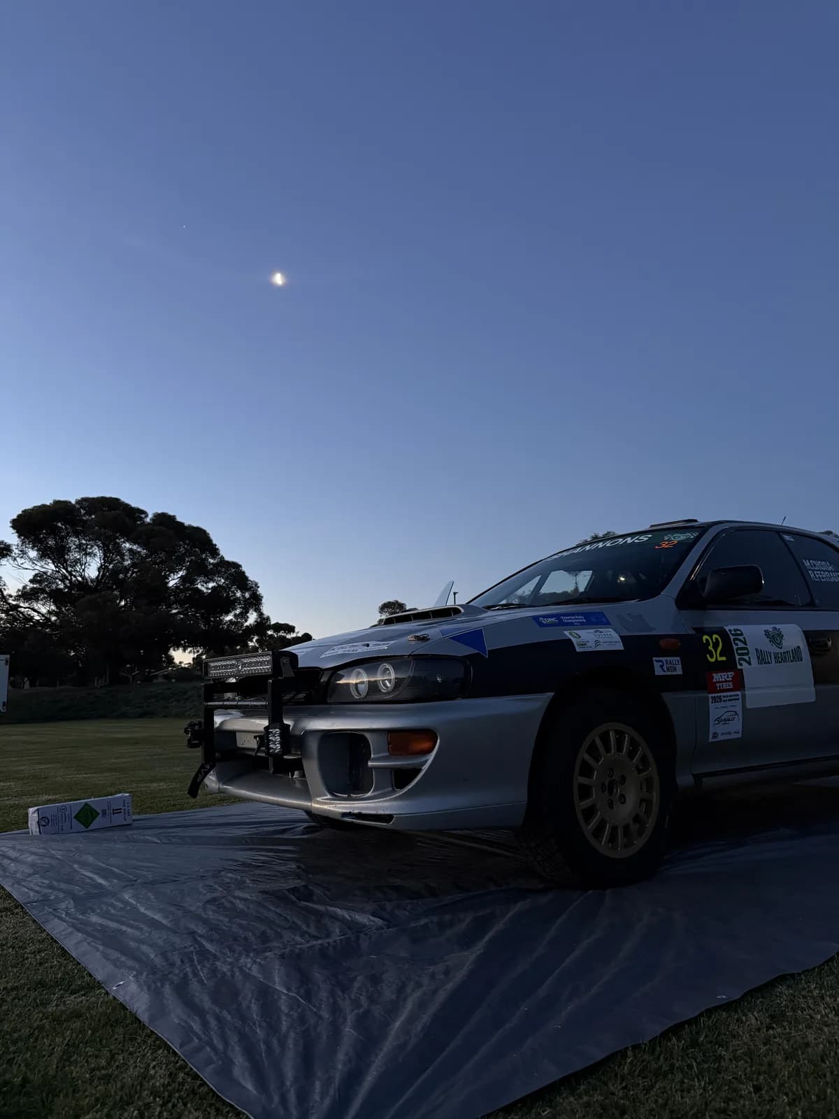 Shakewell Racing Subaru Impreza with light pods at dusk at the Rally of the Heartland