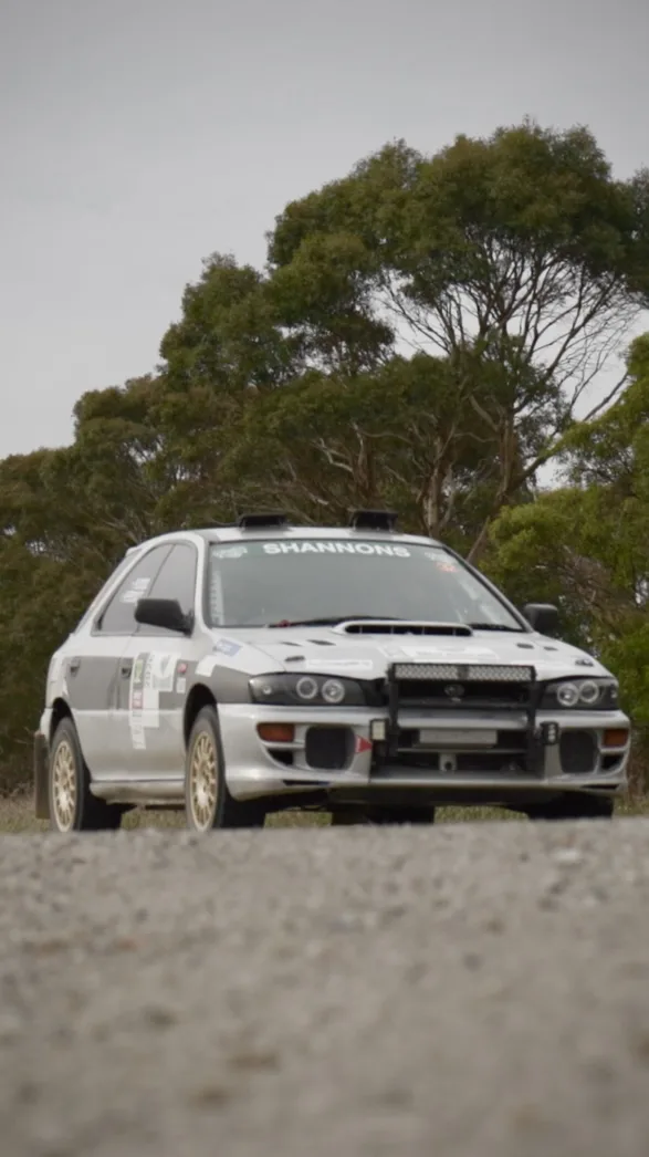Shakewell Racing Subaru Impreza in a field at the Rally of the Heartland service