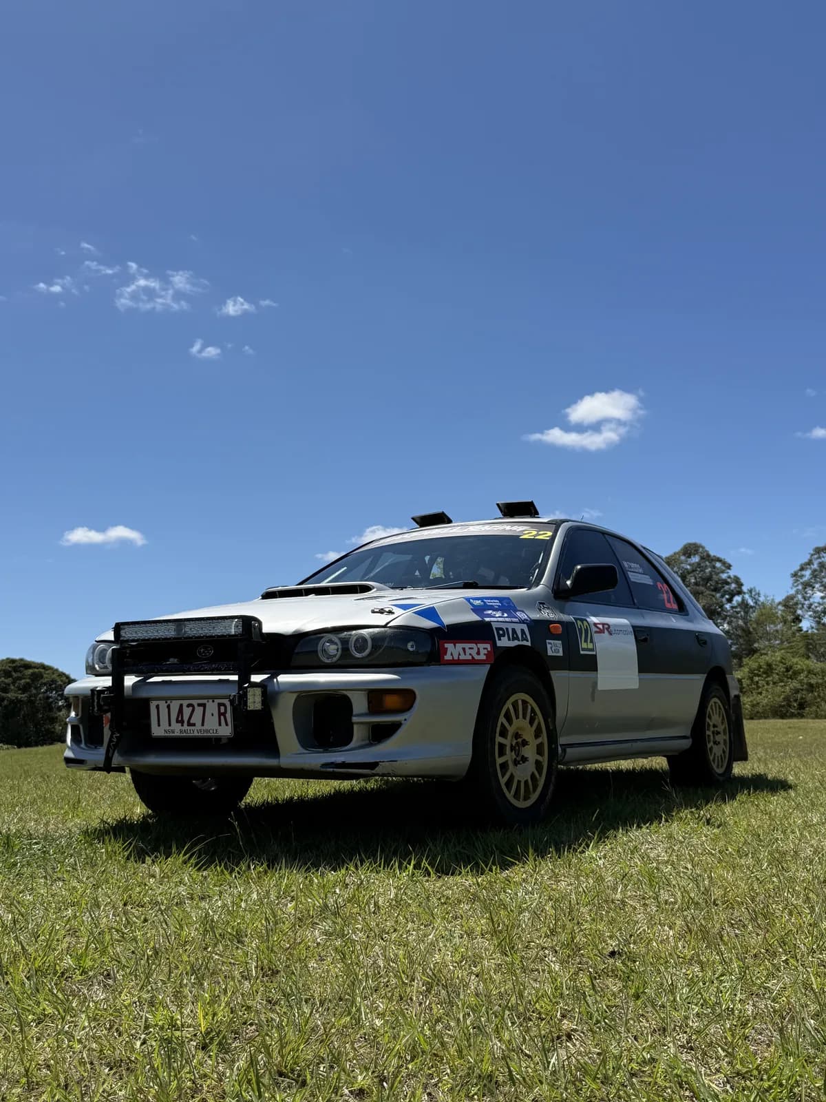 The Shakewell Racing Subaru Impreza wagon under a clear Queensland sky on Saturday morning at the Imbil Rally
