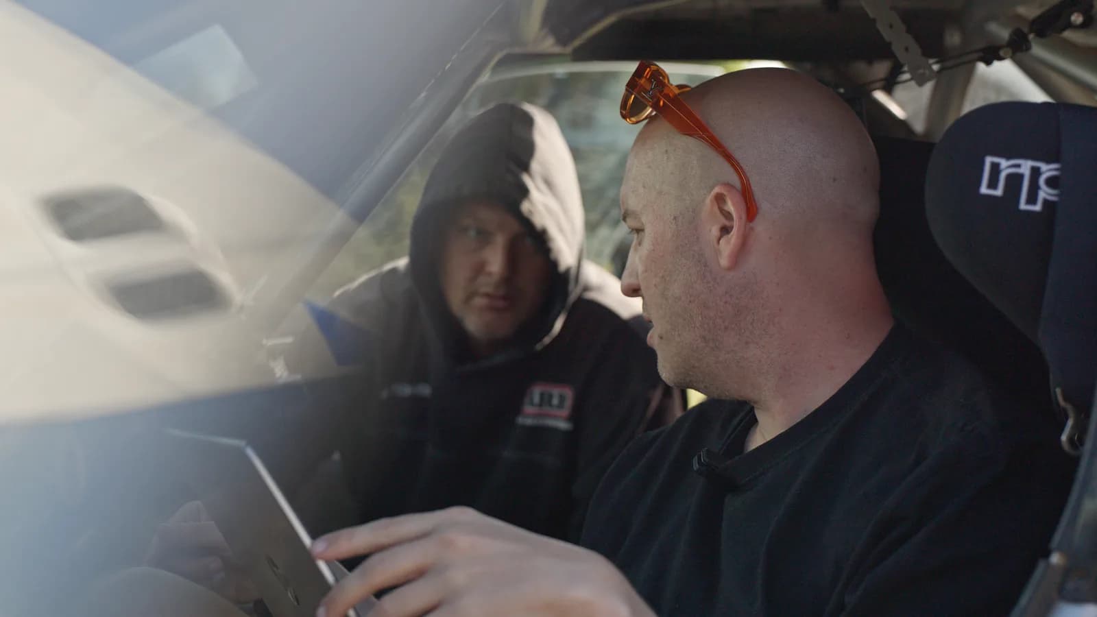 The crew checking a laptop inside the Shakewell Racing Impreza at the Imbil Rally