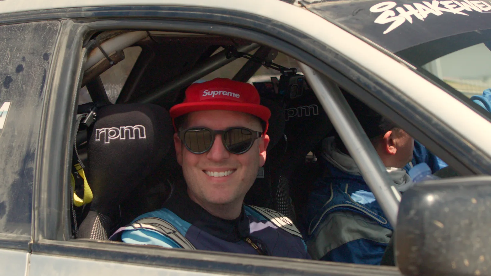 Grinning from the cockpit of the Shakewell Racing Impreza at the Imbil Rally