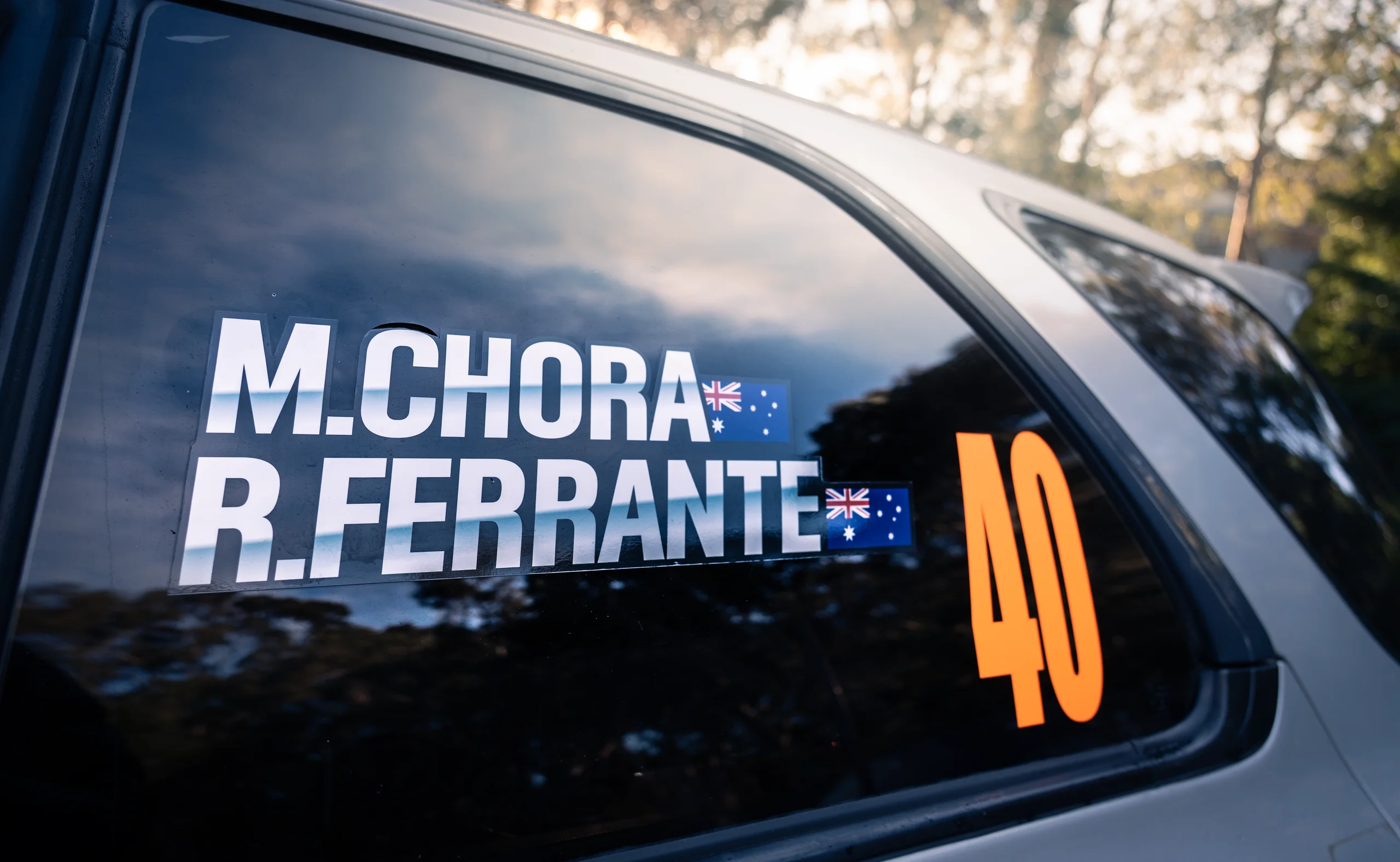 The M.Chora and R.Ferrante window decals on car 40 at the Narooma Forest Rally