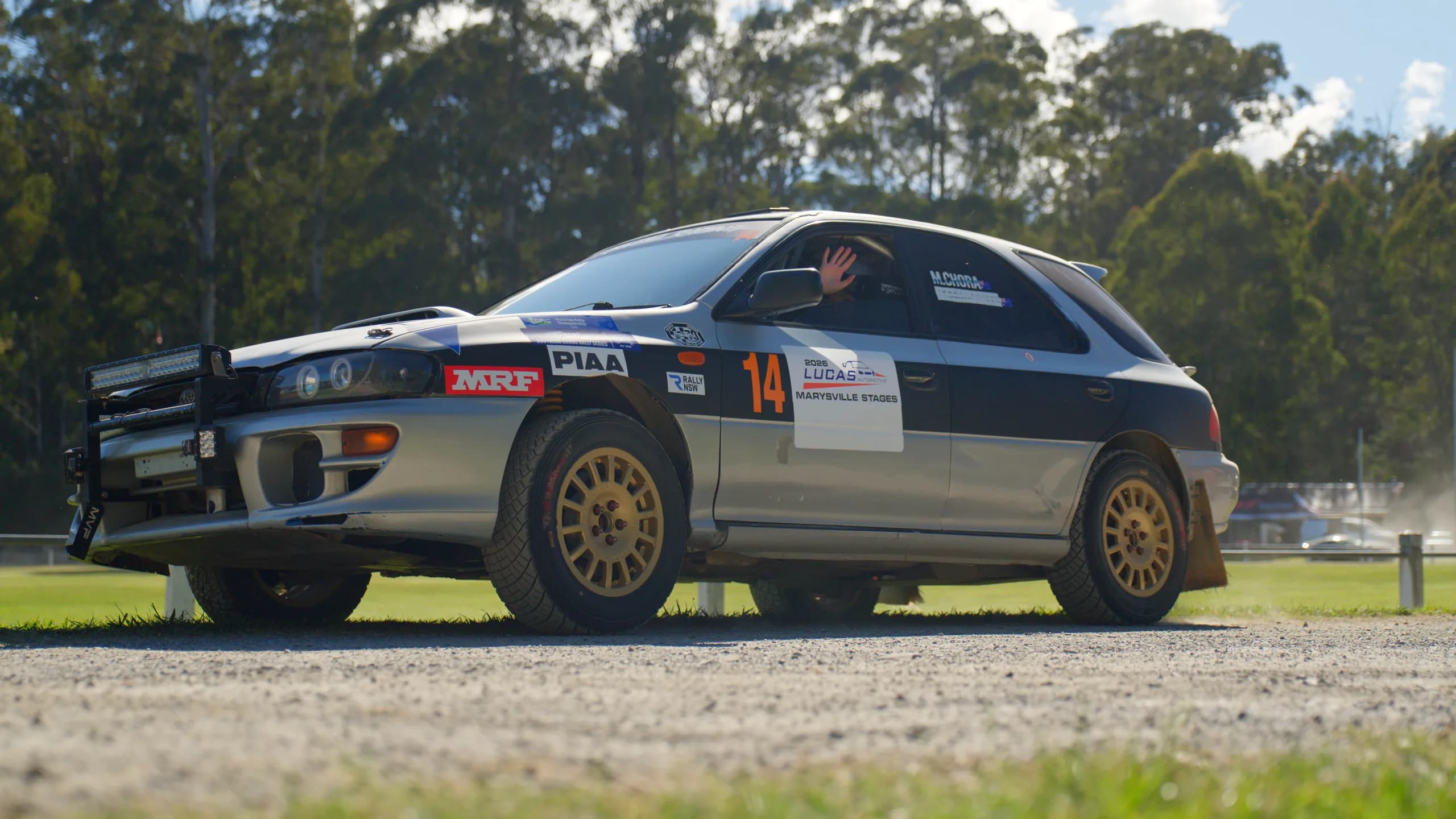 Car 14, the Shakewell Racing Subaru Impreza wagon, on gold wheels on the gravel at the Marysville Stages 2026