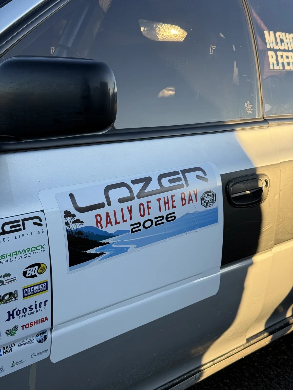 Lazer Rally of the Bay 2026 door decal on the Shakewell Racing Subaru Impreza