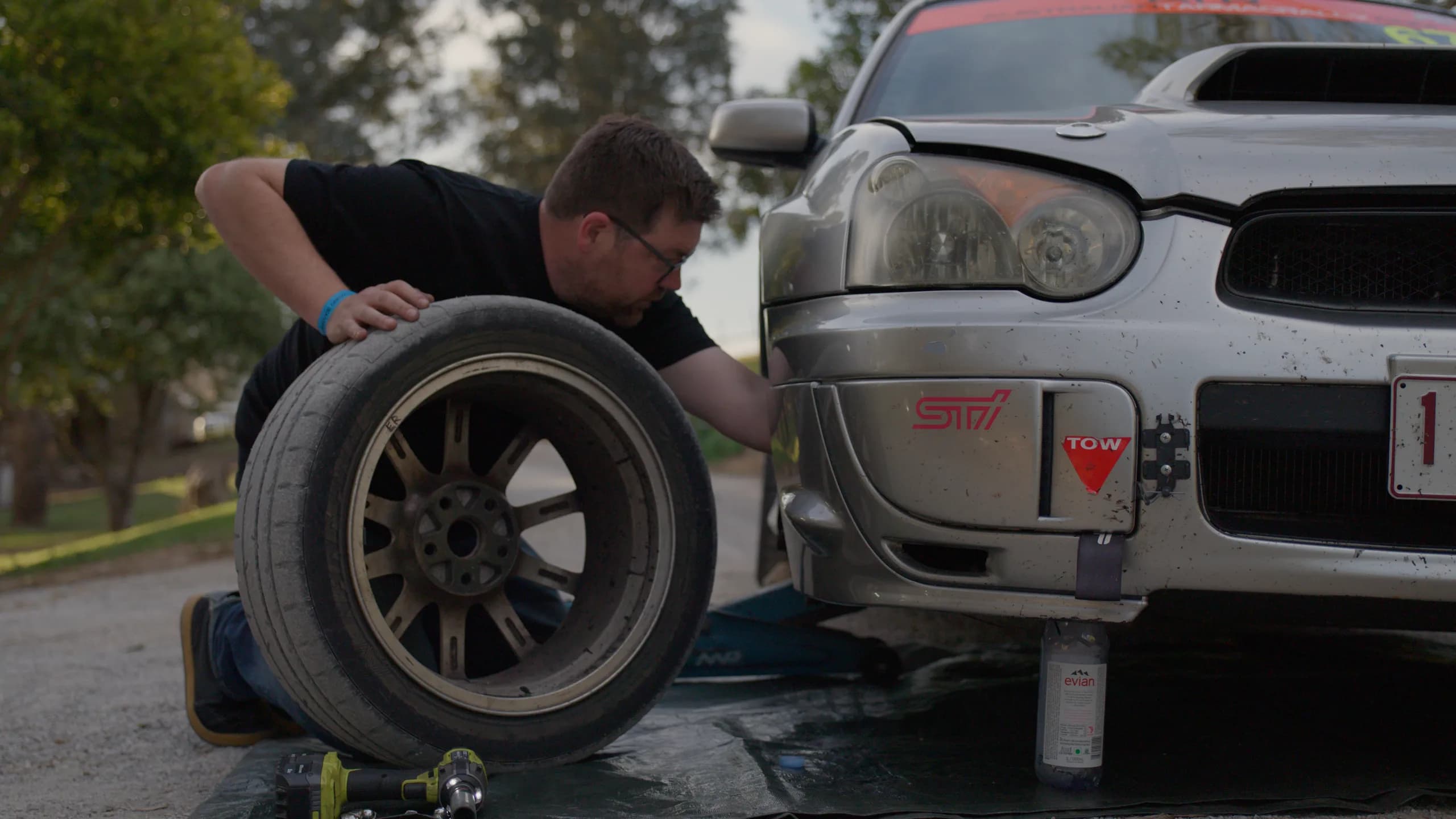 The Shakewell Racing WRX STI up on stands with a wheel off at the Snowy River Sprint